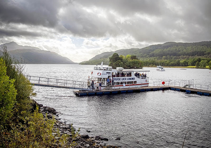 The cruise Loch Lomond ferry approaching the Inversnaid Hotel pier