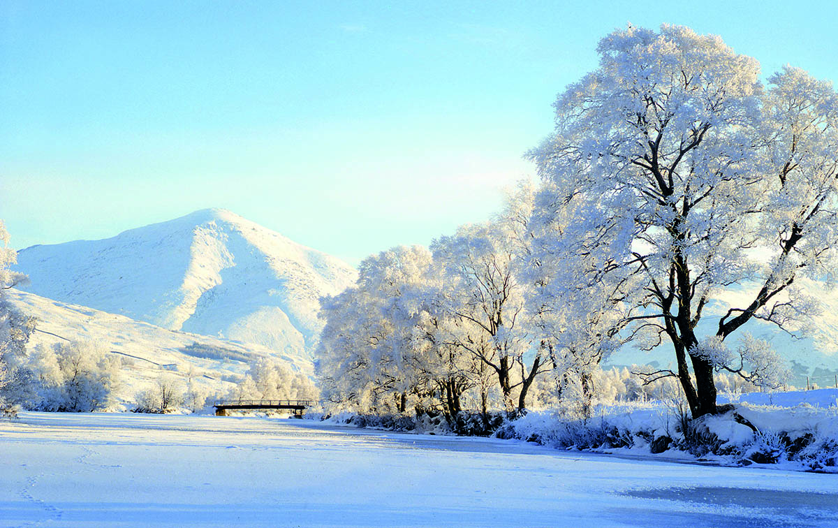 In this edition, our featured photo captures a magical snow scene, with the frozen River Fillan in the foreground and the formidable Ben More towering in the background.