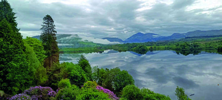 View of Loch Awe from a landing window, with tranquil waters and surrounding hills.