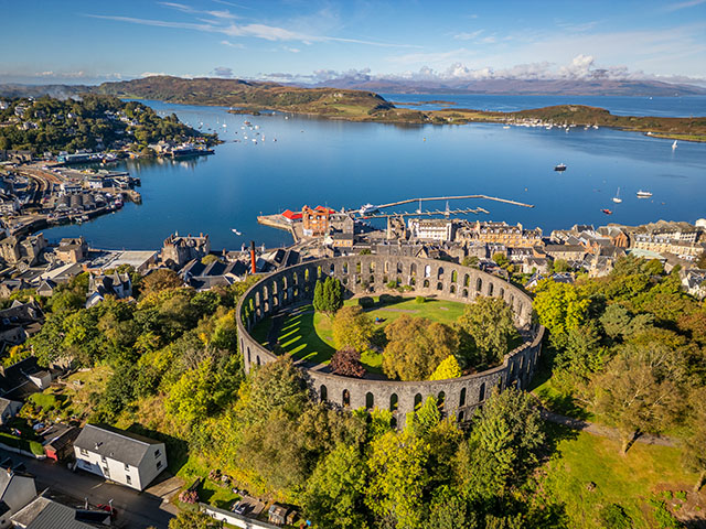 Panoramic view of Oban with McCaig's Tower perched on Battery Hill, overlooking the town and Oban Bay on Scotland's west coast