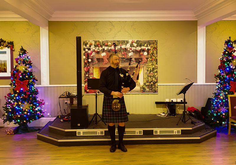 Piper performing at Loch Achray Hotel entertainment evening