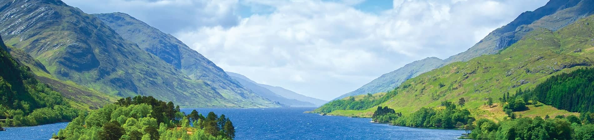 Gazing across a gorgeous loch enjoying a coach tour with Lochs and Glens.