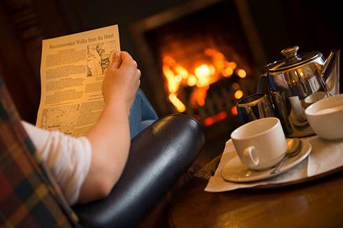Walks pamphlet and a hotel tea tray with teapot and cups